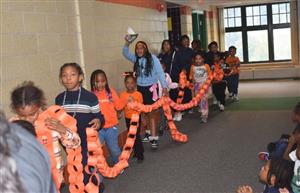  Students holding rings symbolizing togetherness at school